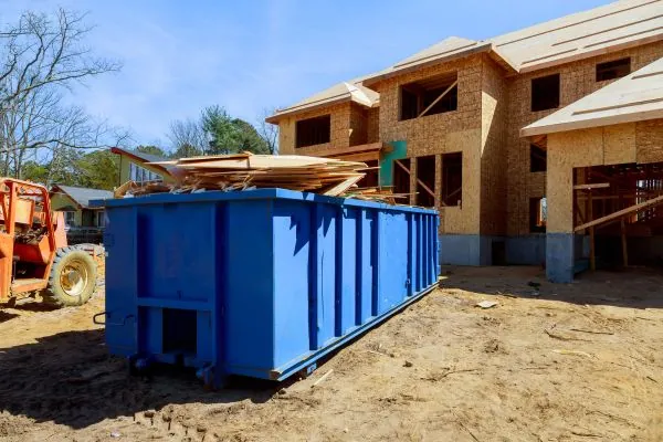 construction trash dumpster with wood